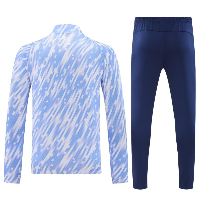 25/26 مانشستر سيتي أبيض مع خطوط زرقاء سماوية مخططة قطريًا نصف سحاب جاكيت رياضي + بنطال طويل
