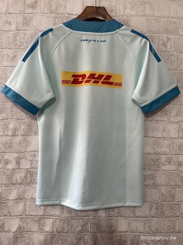 24/25 قميص مونستر أزرق فاتح مع أطواق باللون الأزرق المخضر والنص الأيرلندي الثالث