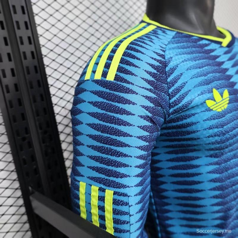 قميص لاعب طويل الأكمام من الإصدار 2027، بلون أزرق خارجي لمنتخب كولومبيا بنمط جاكار متموج