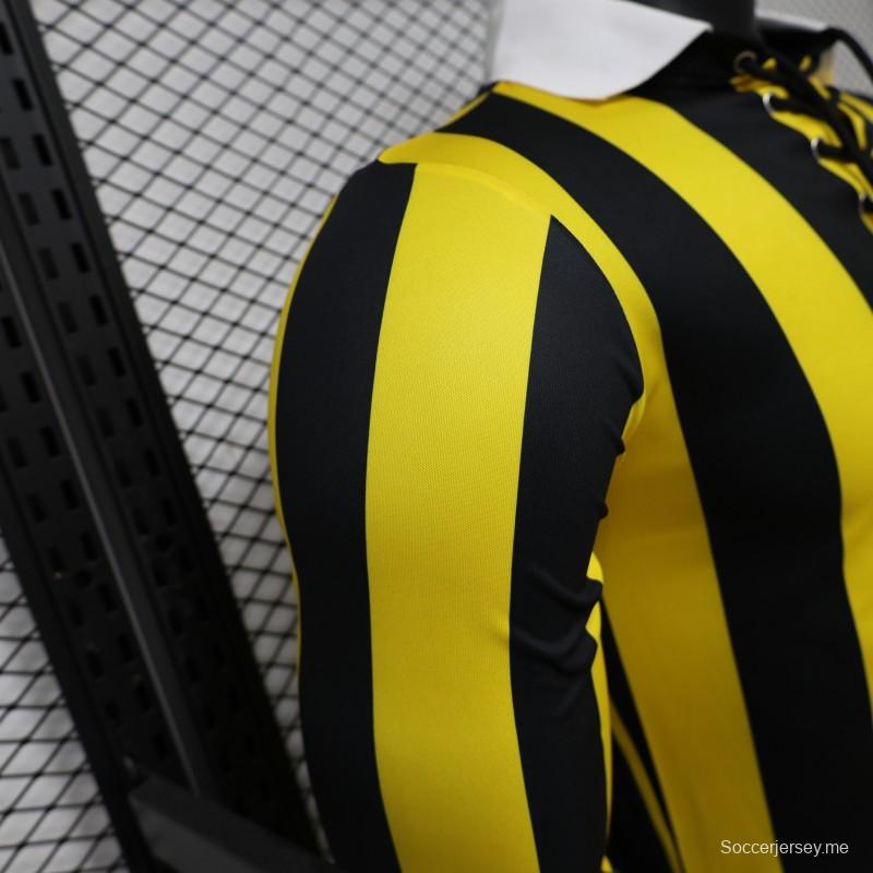 قميص لاعب من طراز 2026، بنقوش عمودية باللونين الأصفر والأسود، بأكمام طويلة، من مجموعة "ريترو هيريتاج" لفريق بينارول