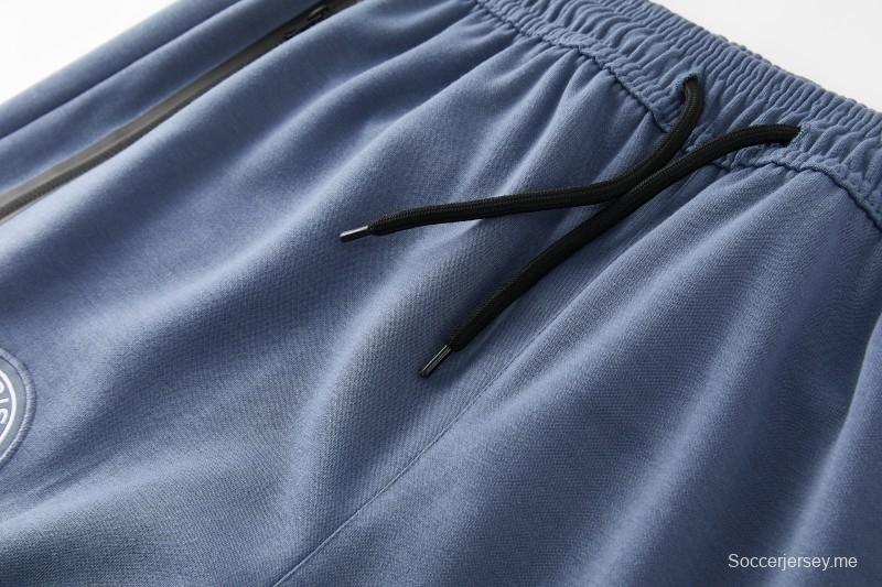 26/27  طقم رياضي من باريس سان جيرمان باللون الأزرق الفولاذي مع سترة بغطاء رأس وسحاب كامل + بنطال طويل