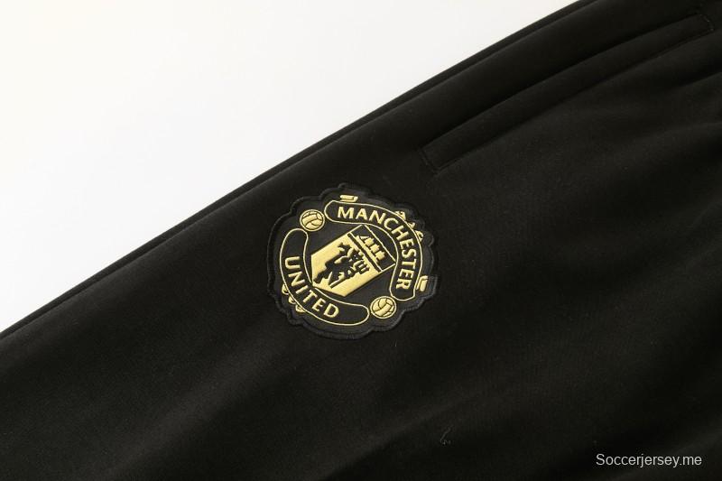 26/27 مانشستر يونايتد - بدلة رياضية سوداء بغطاء رأس وبنطال طويل