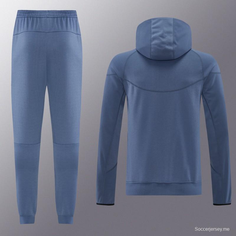 26/27  طقم رياضي من باريس سان جيرمان باللون الأزرق الفولاذي مع سترة بغطاء رأس وسحاب كامل + بنطال طويل