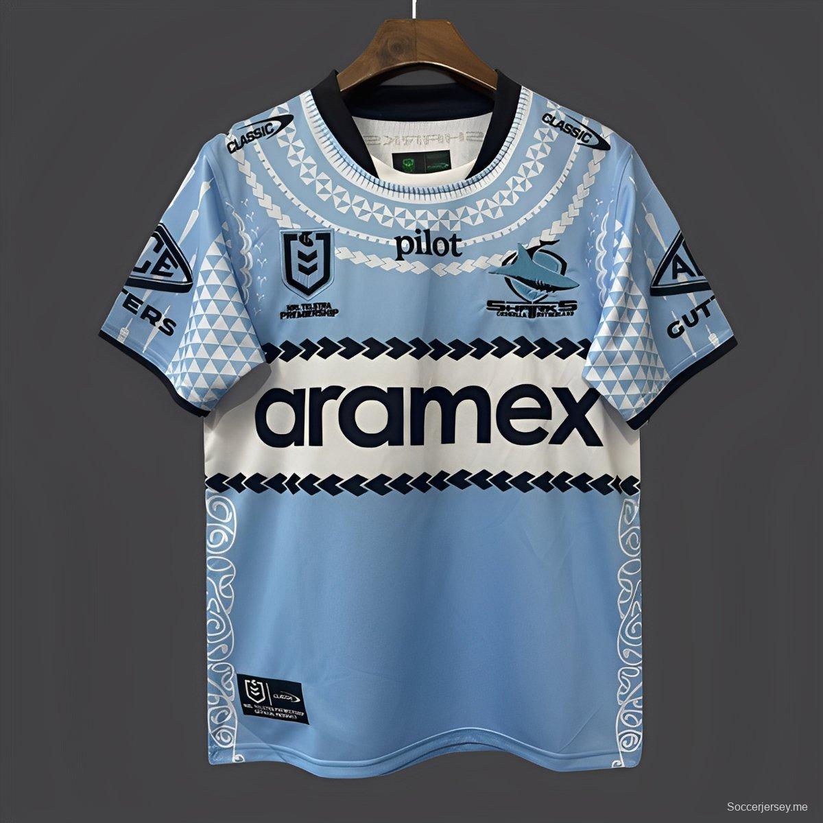 25/26 كرونولا - ساذرلاند شاركس كرونولا - ساذرلاند شاركس أزرق سماوي مع قميص تراث السكان الأصليين